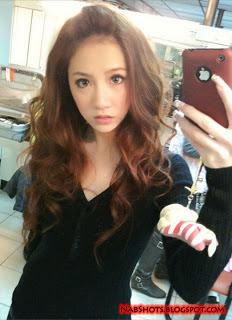 Lin Cai Ti taking a selfie