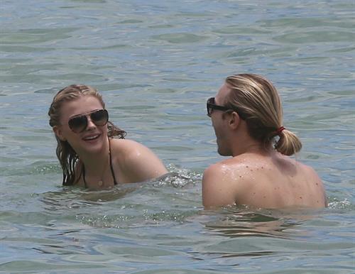 Chloe Grace Moretz candids in a Black Bikini in Miami Beach