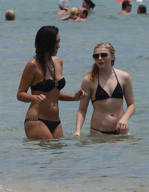 Chloe Grace Moretz candids in a Black Bikini in Miami Beach