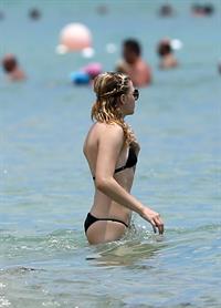 Chloe Grace Moretz candids in a Black Bikini in Miami Beach