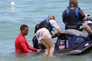 Chloe Grace Moretz candids in a Black Bikini in Miami Beach