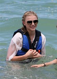 Chloe Grace Moretz candids in a Black Bikini in Miami Beach