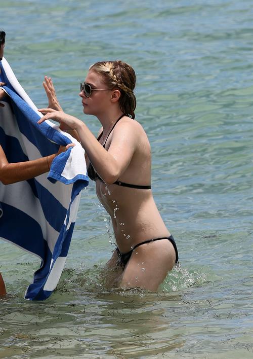 Chloe Grace Moretz candids in a Black Bikini in Miami Beach