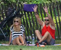 Heidi Klum in a black and white striped shirt, spends a day out in a park in Tribeca on June 30, 2013 