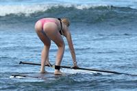 Ireland Baldwin goes paddle-boarding in Hawaii with her boyfriend Slater Trout May 26, 2013 