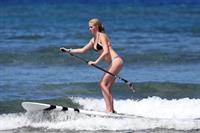 Ireland Baldwin goes paddle-boarding in Hawaii with her boyfriend Slater Trout May 26, 2013 