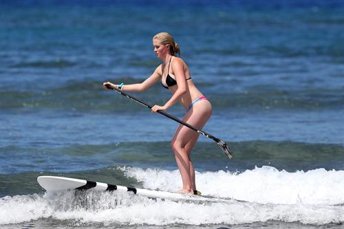 Ireland Baldwin goes paddle-boarding in Hawaii with her boyfriend Slater Trout May 26, 2013 