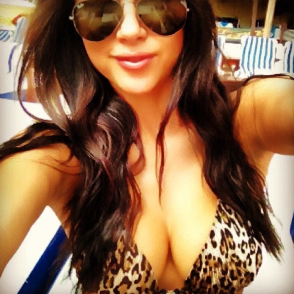 Arianny Celeste in a bikini taking a selfie