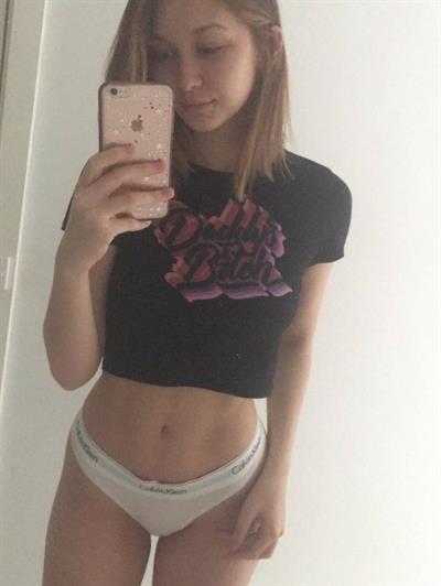 Jean Champion in lingerie taking a selfie