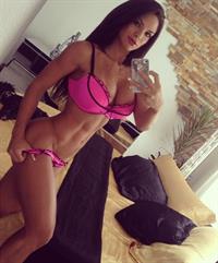 Michelle Lewin in a bikini taking a selfie