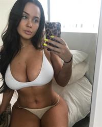 Sarah MacDonald in a bikini taking a selfie