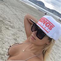 Liziane Soares in a bikini taking a selfie