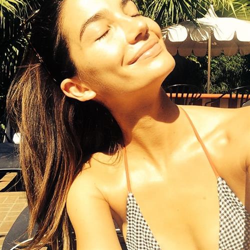Lily Aldridge in a bikini taking a selfie