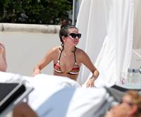 Selena Gomez in bikini by a hotel pool in Miami 5/11/13 