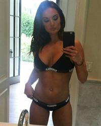 Whitney Johns in a bikini taking a selfie