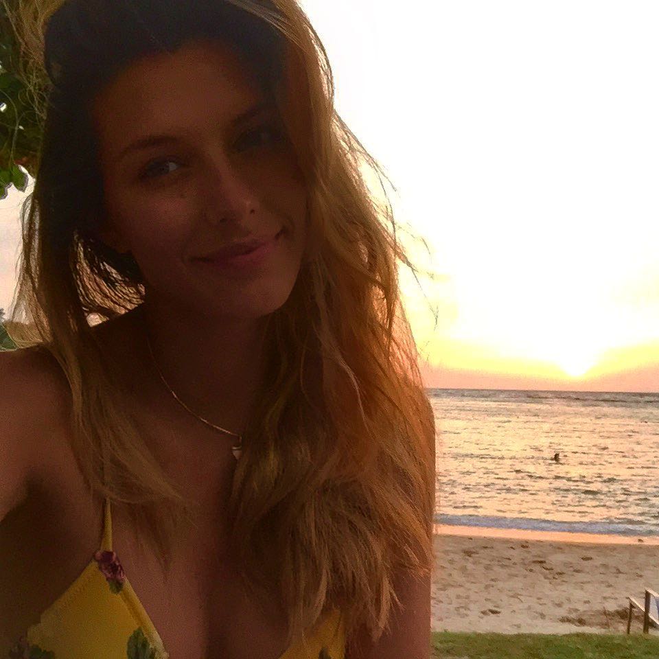 Camille Cerf in a bikini taking a selfie