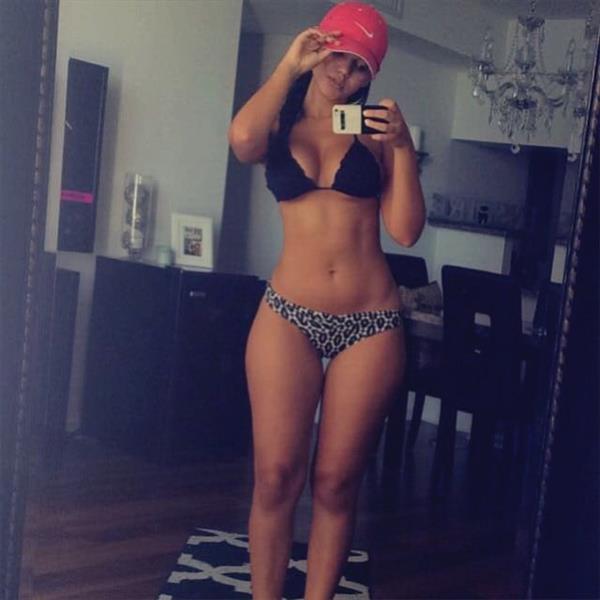 Damaris Lopez in a bikini taking a selfie