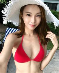 Cathryn Lee in a bikini taking a selfie