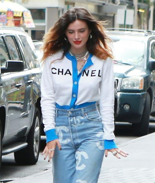 Bella Thorne Pictures Bella Thorne braless tits seen by paparazzi showing her pierced nipple dressed all in Chanel.