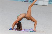 Claudia Romani sexy doing yoga at the beach in a thong bikini showing off her boobs and ass seen by paparazzi.





















