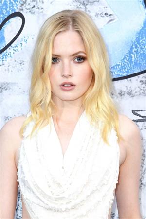 Ellie Bamber braless boobs while wearing basically a scarf as a top showing side boob cleavage.









