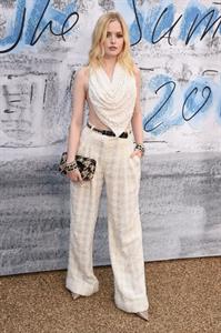 Ellie Bamber braless boobs while wearing basically a scarf as a top showing side boob cleavage.








