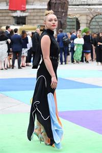 Florence Pugh braless tits pokies in a black dress.















