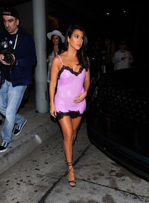 Kourtney Kardashian sexy see through pink mini dress showing her braless boobs and ass in a thong.


