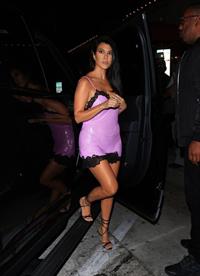 Kourtney Kardashian sexy see through pink mini dress showing her braless boobs and ass in a thong.


