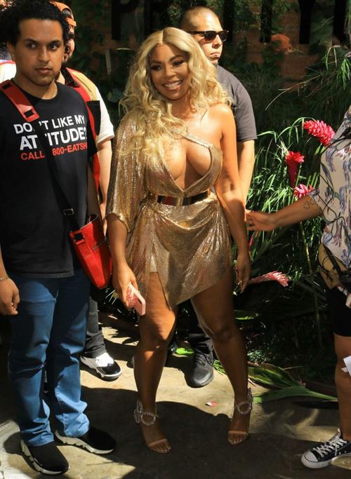 Ashanti sexy cleavage in a low cut dress at the PrettyLittleThings launch party.

