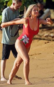 Katy Perry sexy swimsuit photos seen by paparazzi at the beach with blonde hair again.








