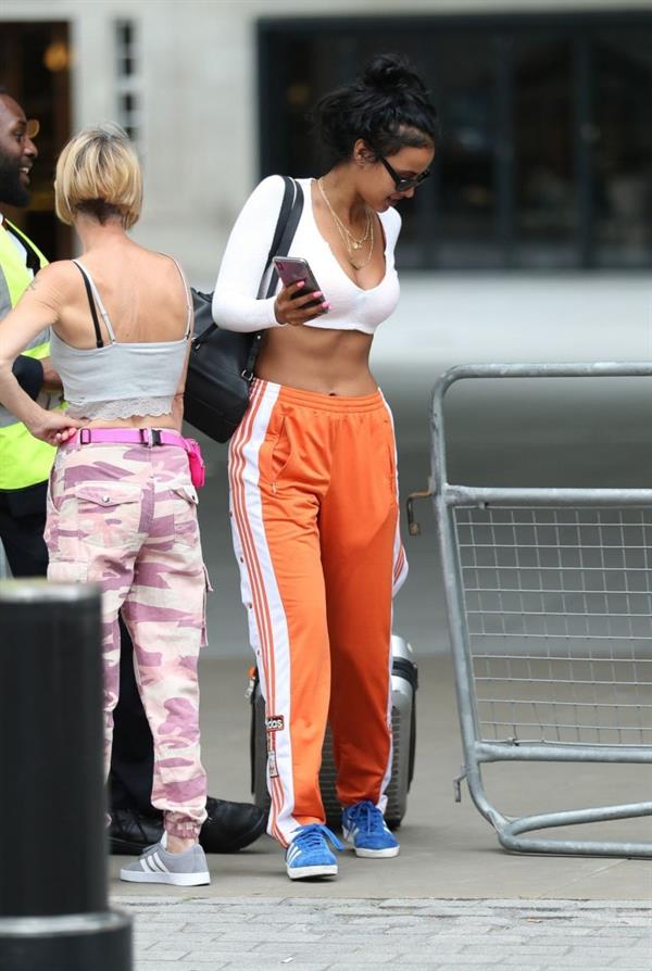 Maya Jama sexy in a crop top showing some nice cleavage seen by paparazzi.










