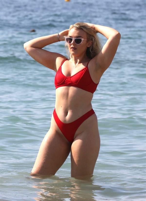 Tallia Storm sexy in a red bikini seen by paparazzi at the beach.











