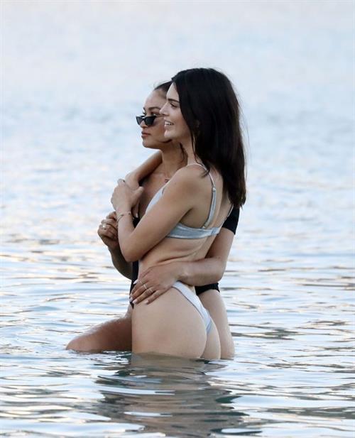Kendall Jenner sexy ass in a thong bikini seen by paparazzi in the water at the beach.




























