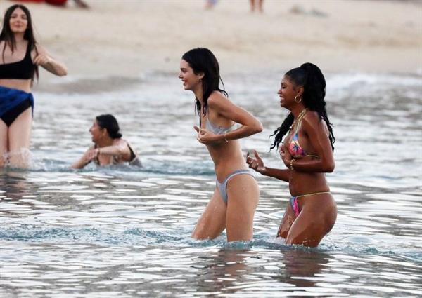Kendall Jenner sexy ass in a thong bikini seen by paparazzi in the water at the beach.




























