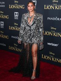 Beyonce braless boobs and areola peek showing off nice cleavage on the red carpet for the premiere of  The Lion King .






