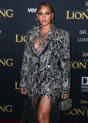 Beyonce braless boobs and areola peek showing off nice cleavage on the red carpet for the premiere of  The Lion King .






