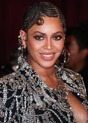 Beyonce braless boobs and areola peek showing off nice cleavage on the red carpet for the premiere of  The Lion King .






