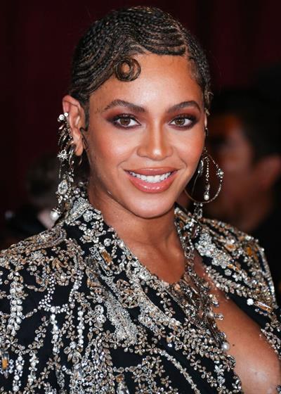 Beyonce braless boobs and areola peek showing off nice cleavage on the red carpet for the premiere of  The Lion King .






