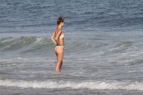 Nina Agdal Bikini Pictures Nina Agdal sexy ass in a thong bikini at the beach with her boyfriend seen by paparazzi.