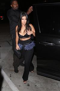 Kourtney Kardashian sexy cleavage in a black top seen by paparazzi.













