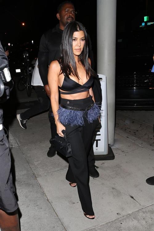 Kourtney Kardashian sexy cleavage in a black top seen by paparazzi.













