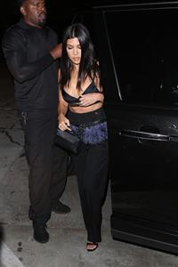 Kourtney Kardashian sexy cleavage in a black top seen by paparazzi.













