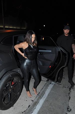 Kim Kardashian sexy in a tight leather outfit seen by paparazzi with her husband Kanye West.















