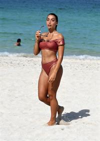 Elisa De Panicis sexy tits pokies and ass in a thong bikini seen by paparazzi.




