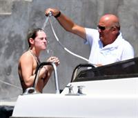 Kristen Stewart nude boobs caught topless by paparazzi tanning on a boat.
