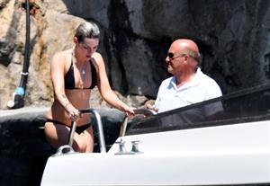 Kristen Stewart nude boobs caught topless by paparazzi tanning on a boat.
