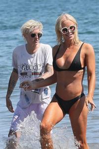 Gigi Gorgeous sexy cleavage in a bikini at the beach with Nats Getty seen by paparazzi.



