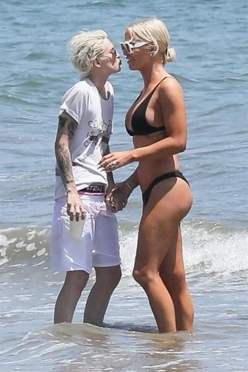 Gigi Gorgeous sexy cleavage in a bikini at the beach with Nats Getty seen by paparazzi.



