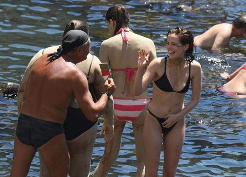 Zoey Deutch Bikini Pictures Zoey Deutch sexy boobs and ass in a little bikini in the water seen by paparazzi.